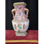 Large famille rose Oriental vase. Stands 13 inches in height.