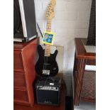 Eleca child's electric guitar with amplifier.