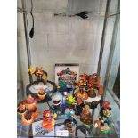 Shelf of PlayStation 3 skylanders with game and ports.