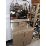 Art deco mirrored back dresser with cabinet base.