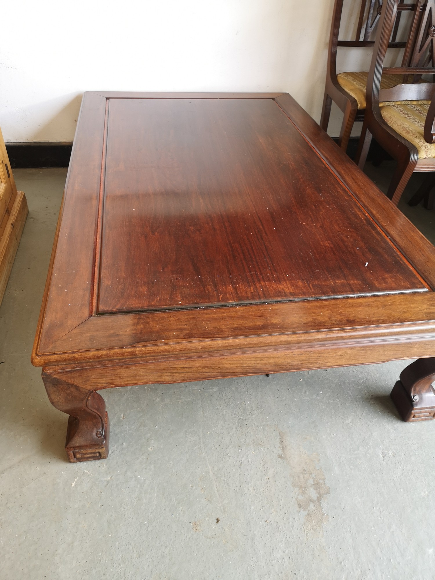 Oriental rosewood coffee table with carved supports. - Image 2 of 2