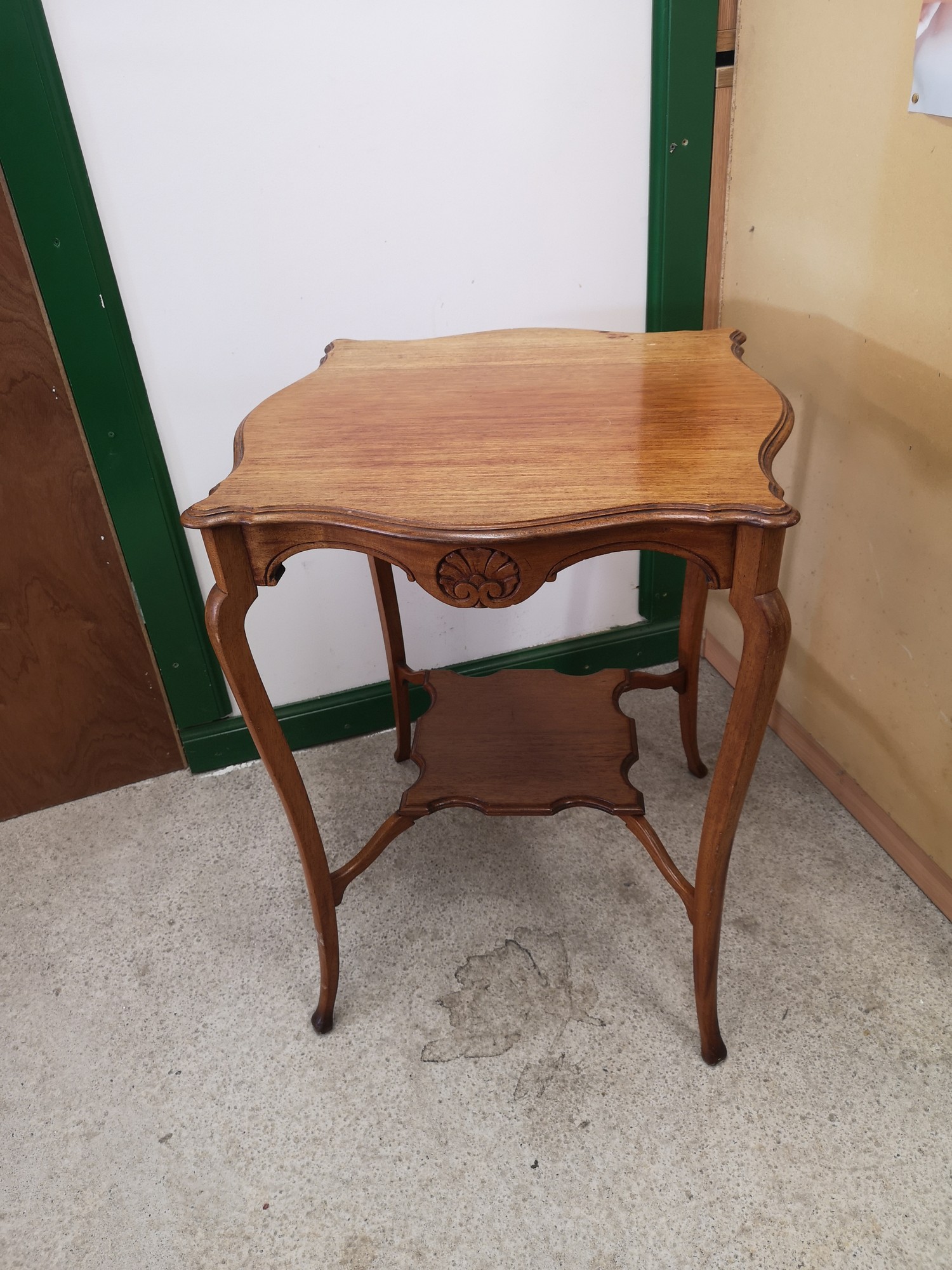 Light 1900s 2 tier window table.