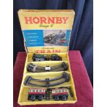 Boxed Horby O gauge clock work train set with track with original box complete with key.