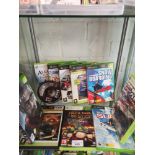 Shelf of xbox original and xbox 360 games.