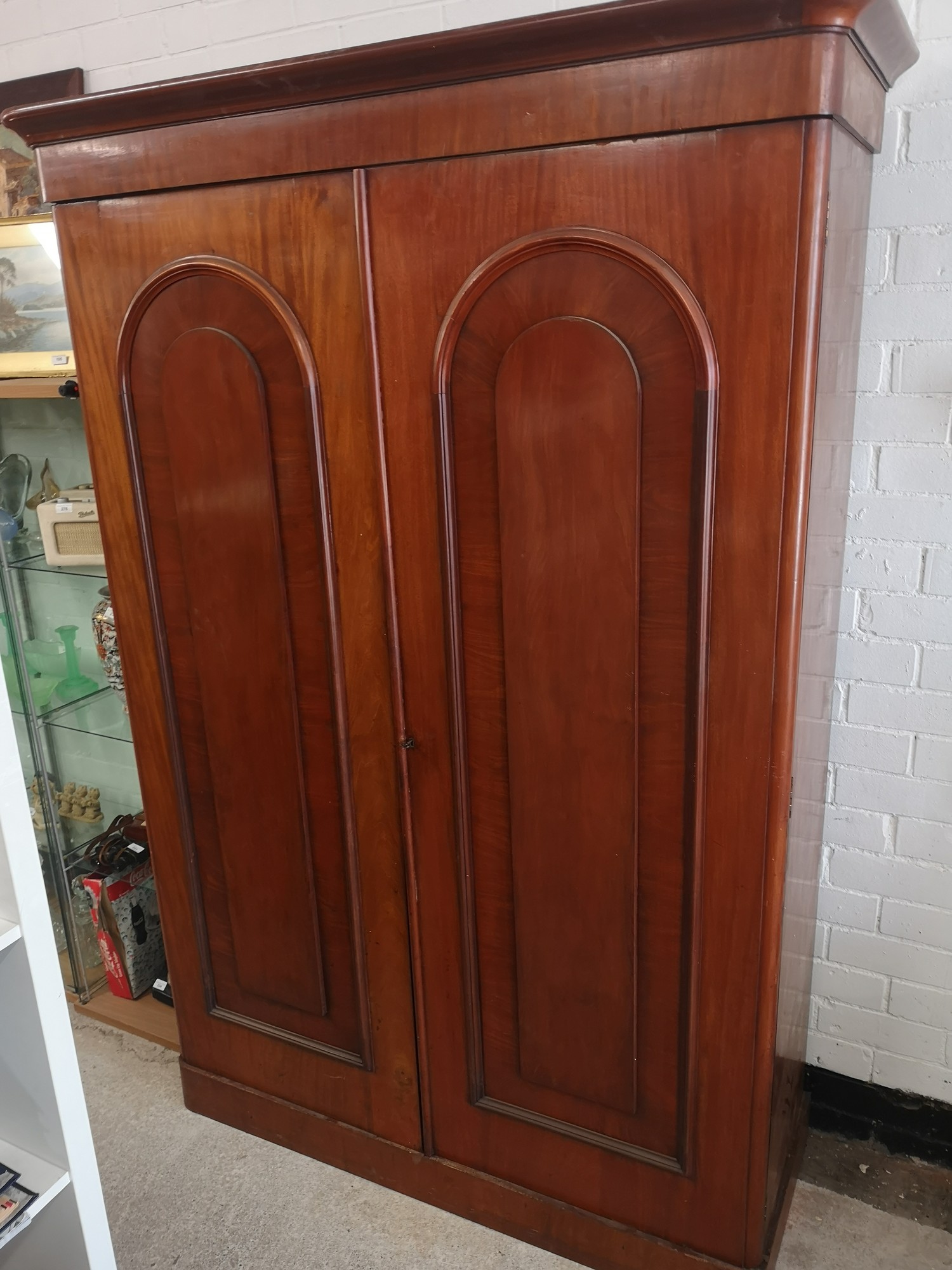 Large Victorian bow fronted wardrobe with fitted drawers and coat hangers.