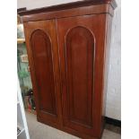 Large Victorian bow fronted wardrobe with fitted drawers and coat hangers.