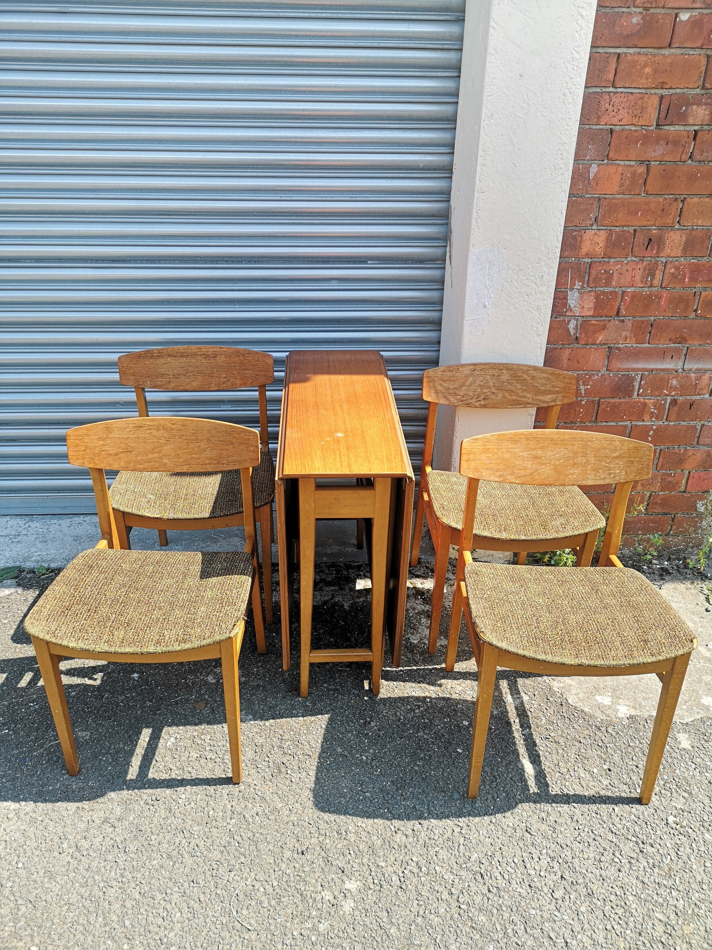 Teak drop table with 6 chairs.