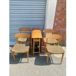 Teak drop table with 6 chairs.
