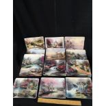 Collection of nature of retreats by Thomas kinkade plates.