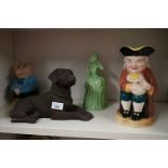 Shelf of collectables includes art deco figure.