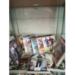 Shelf of PlayStation 3 games.