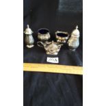 5 piece silver Hall marked cruet set with liner.