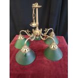 Retro brass ceiling light with green shading.