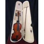 Violin in bow in fitted case.