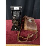 J. B. Bell of Edinburgh opticians bellows folding camera with leather casing.
