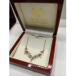 9ct gold necklace set with diamond chip . Tested as diamond s.