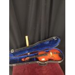 Violin in fitted case.