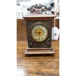 Antique 1900s carriage clock with enamelled face and key wynder.