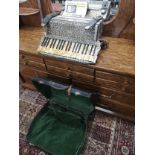 Horner accordian in fitted case.