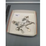 Collection of 6 silver necklaces with pendants etc .