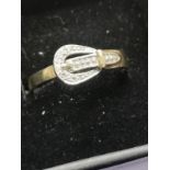 9ct gold diamond buckle ring size R.