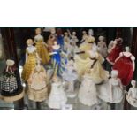 Shelf of lady figures includes doulton.