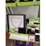 Shelf of New Boxed Costume jewellery items .