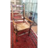 Antique child's ladder back arm Chair.