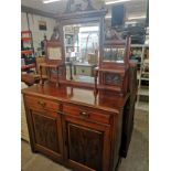 Large 1900s dresser with mirrored back.