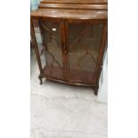 1930s China cabinet with glass shelving .