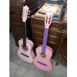 2 Pink Acoustic Guitars .