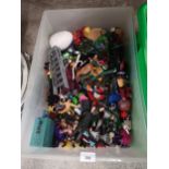 Box of toy action figures etc .
