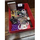 Box of costume jewellery .