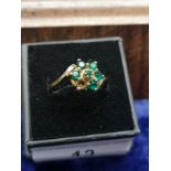 9ct gold green stone ring . 1 stone missing . size R.