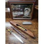 Lot of curiosities to include small dagger, coca cola mirror harmonica and novelty item..