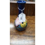 Early Moorcroft blue ground vase with water lily design 16 cm in height impressed marking .