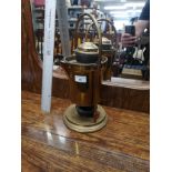 Antique brass tea urn on stand .