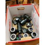 Lot of cameras include canon , large lot of camera lenses etc .
