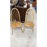 Pair of Ercol golden blonde Windsor chairs .