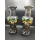 Large pair of lacquered oriental vases depicting oriental scenes over 12 inches in height ..