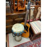 African style drum together with Eros 14207 acoustic guitar no strings .