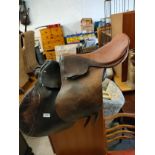 2 leather horse saddles .