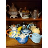 2 shelfs of tea pots includes art Deco chrome tea pot .
