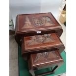 Set of 3 Oriental nest of tables with carvings .