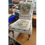 Victorian lovely spoon backed chair on 1900s supports with casters and lovely upholstery.