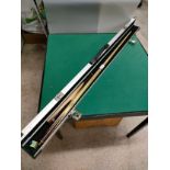 Large snooker cue in fitted metal casing .