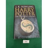 First edition j k Rowling Harry Potter and the deathly hallows book.