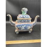 Large early Chinese sensor porcelain temple pot with cover with dragon foliage .