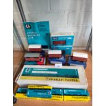 Shelf of 00 gauge wagons , Graham farish suburban building kit etc .