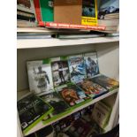 Shelf of Xbox 360 games .